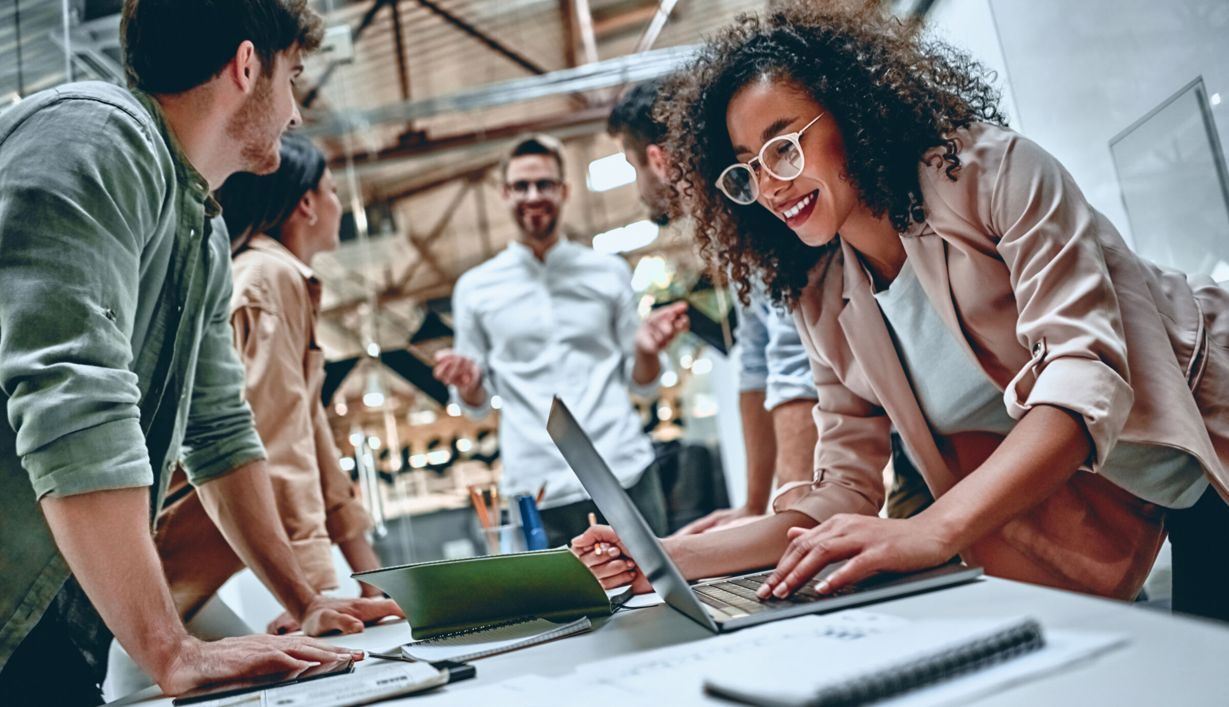 Sage70 consultant and clients lean over table