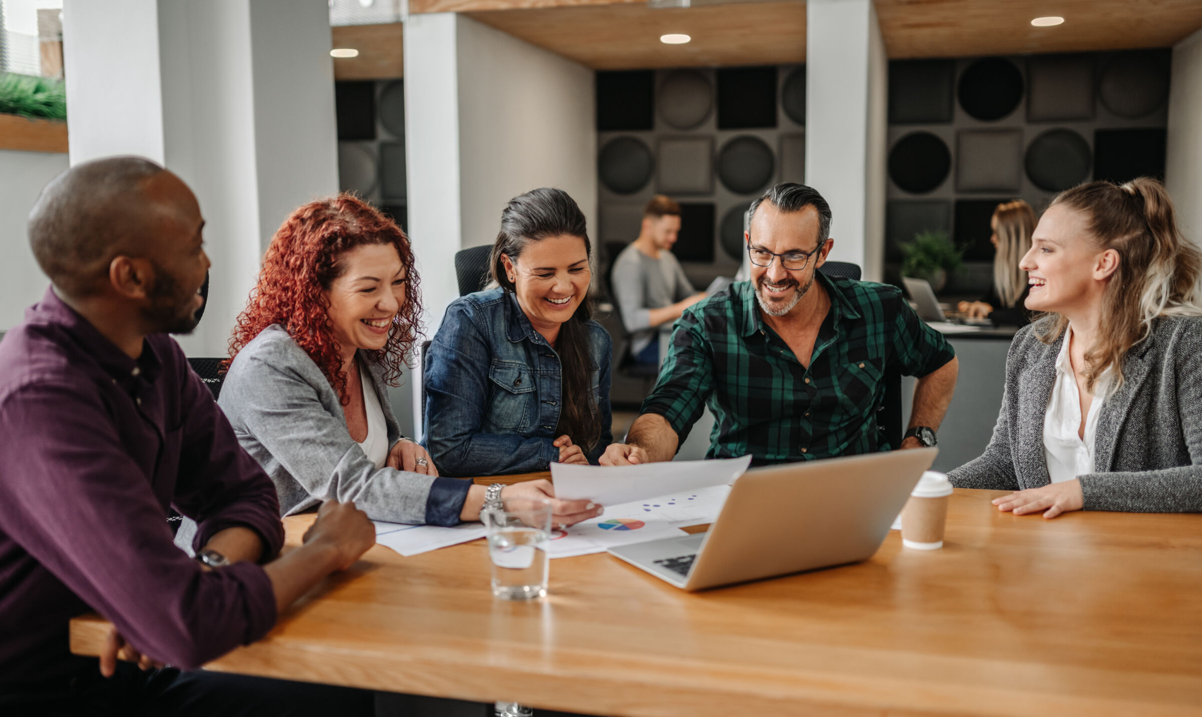 Sage70 client team enjoying a moment of levity while working