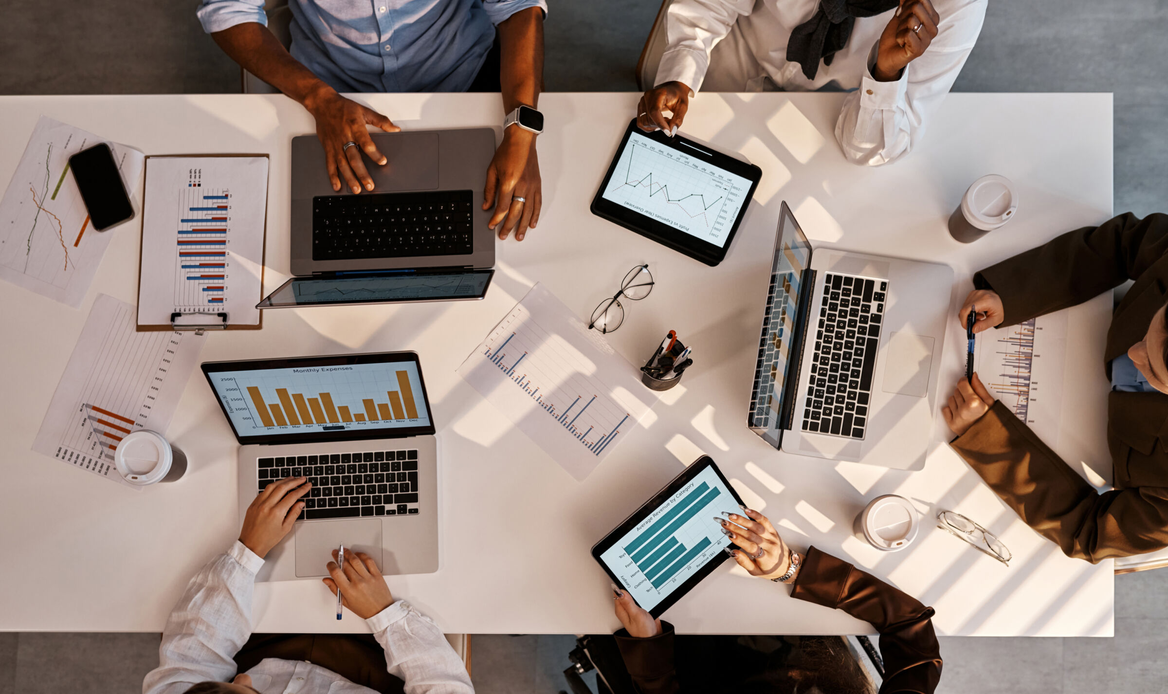 Top down view of a table filled with devices showing reports for Sage70 clients