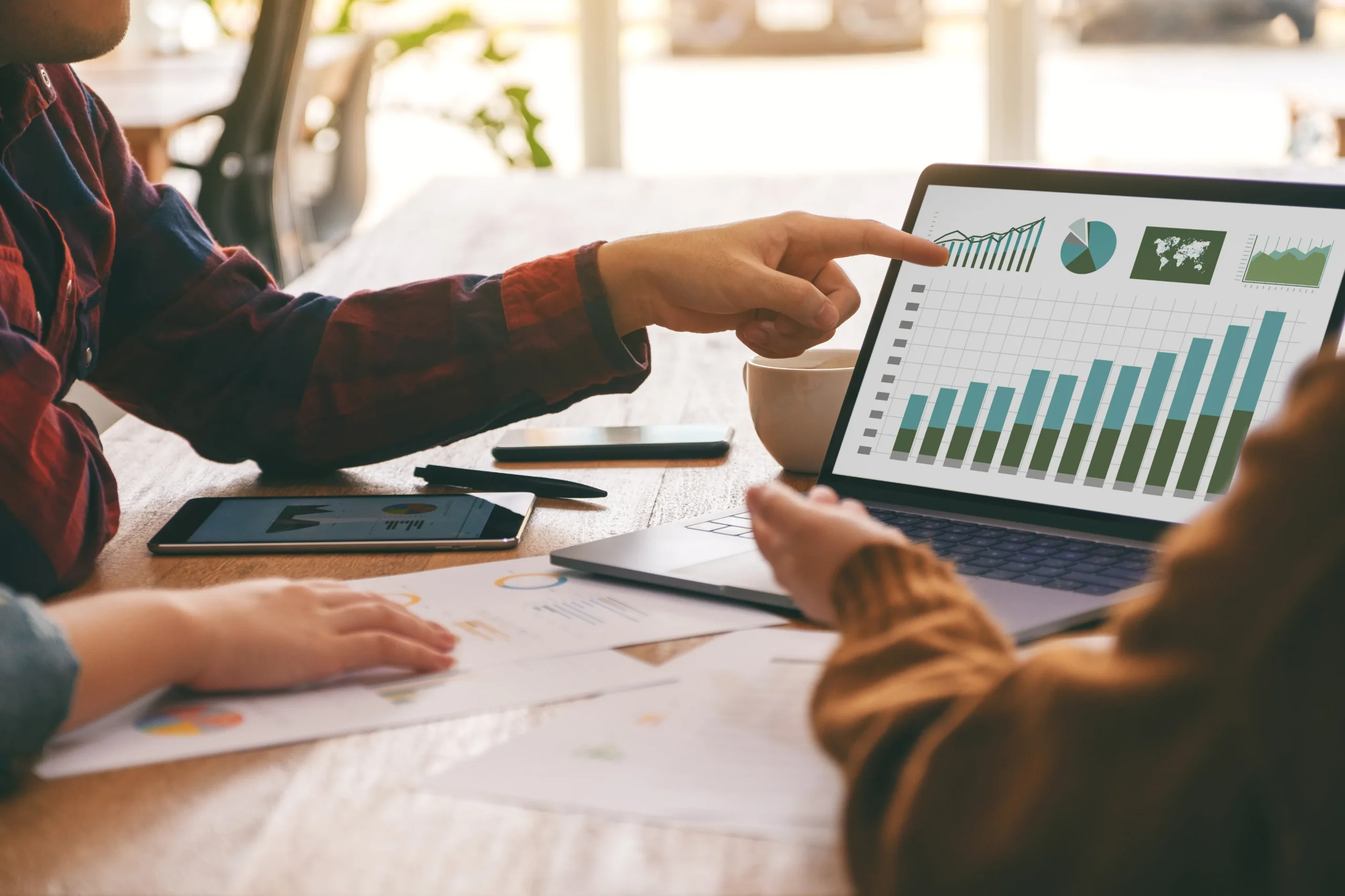 Sage 70 consultant pointing at a graph